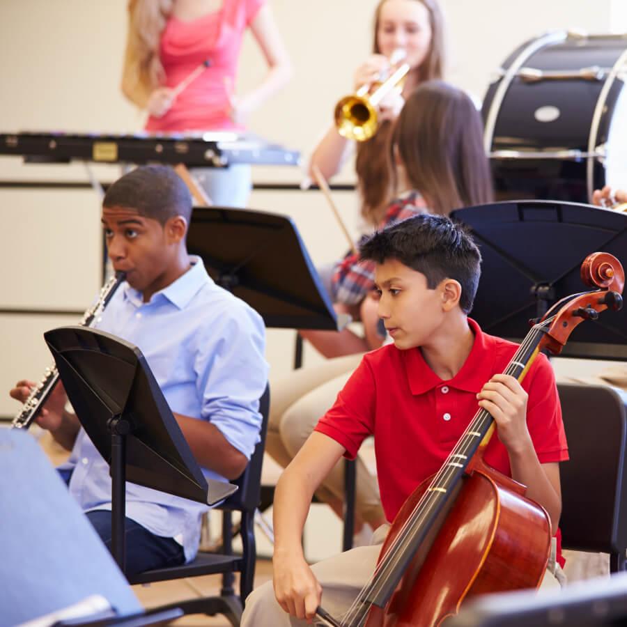 Pupils Playing Musical Instruments In School Orchestra