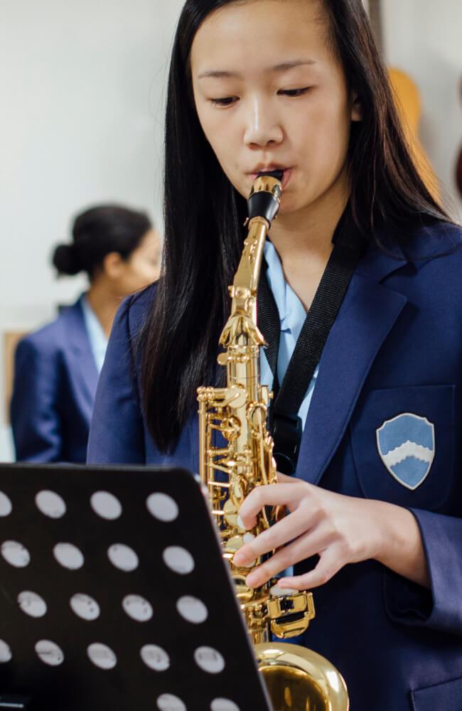 Student playing a saxaphone